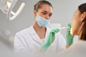 Dentist Examining Patient